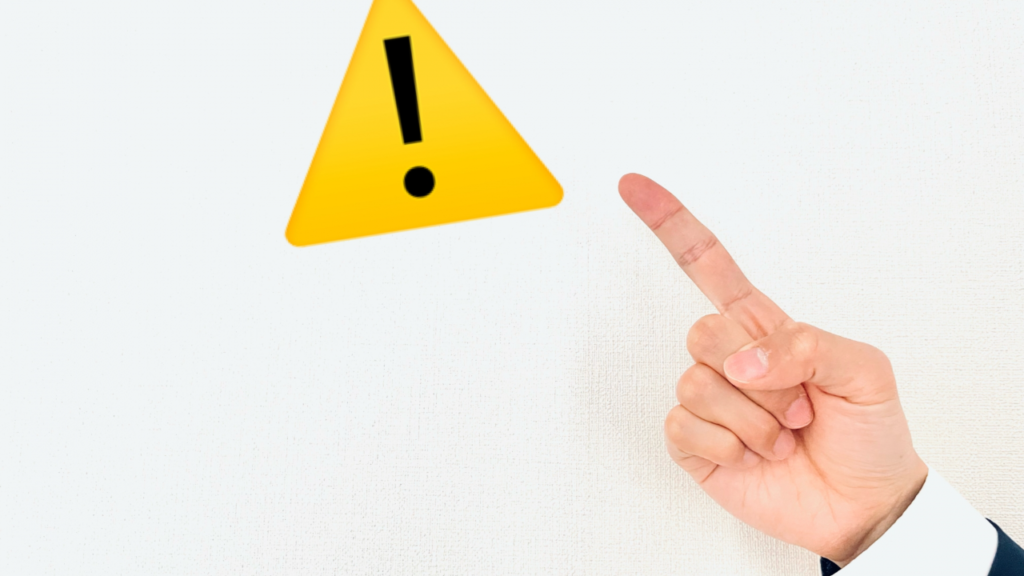 注意の看板を指さし